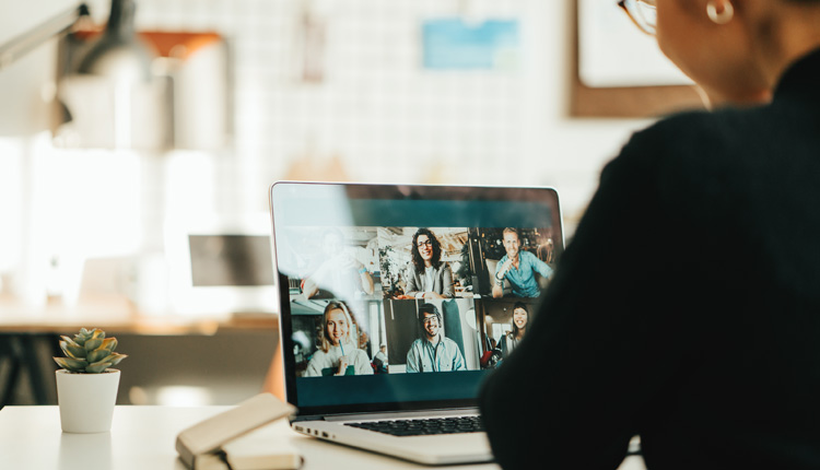 Image of a person participating in a video meeting on a laptop